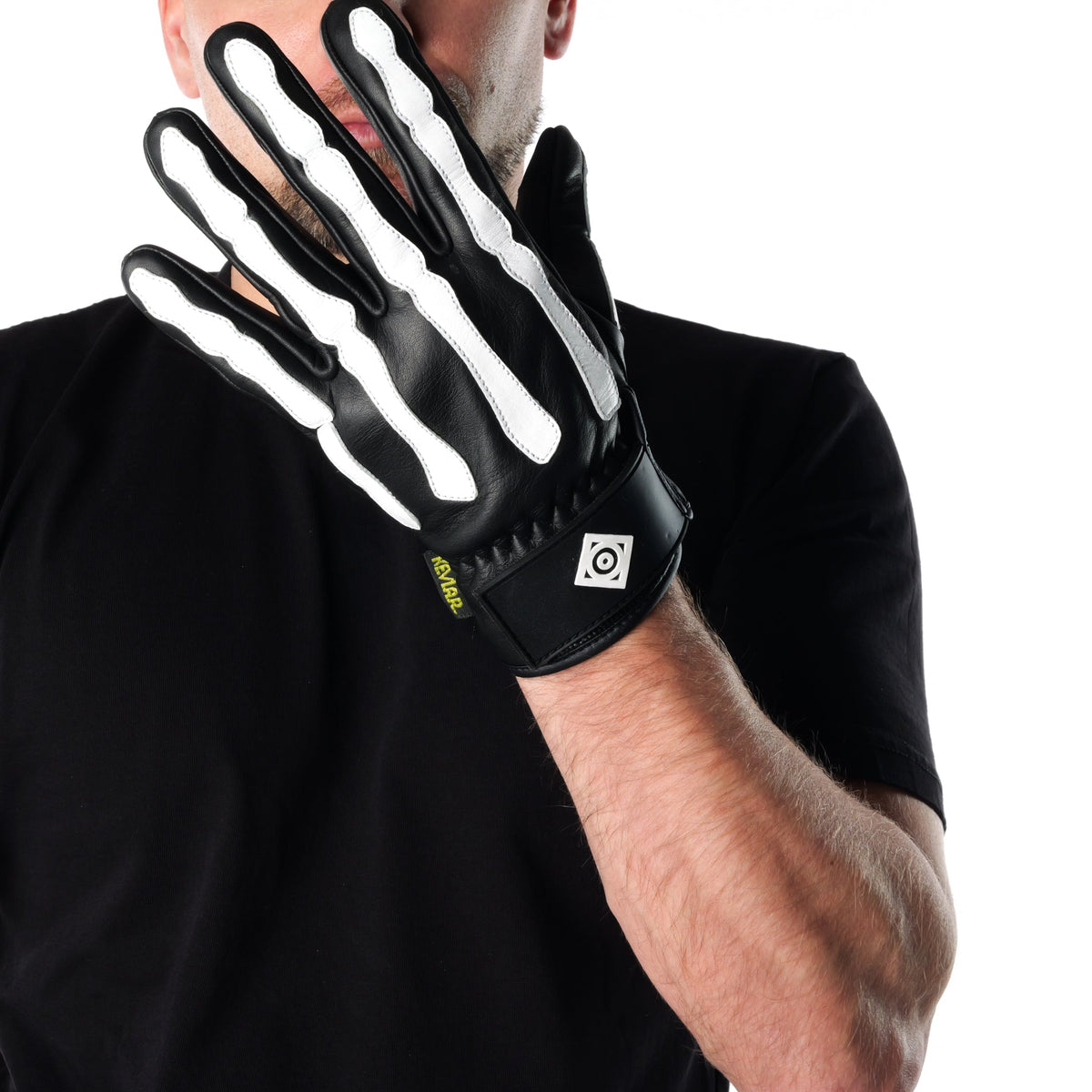 Rider wearing a black and white skeleton-print ONSRA glove