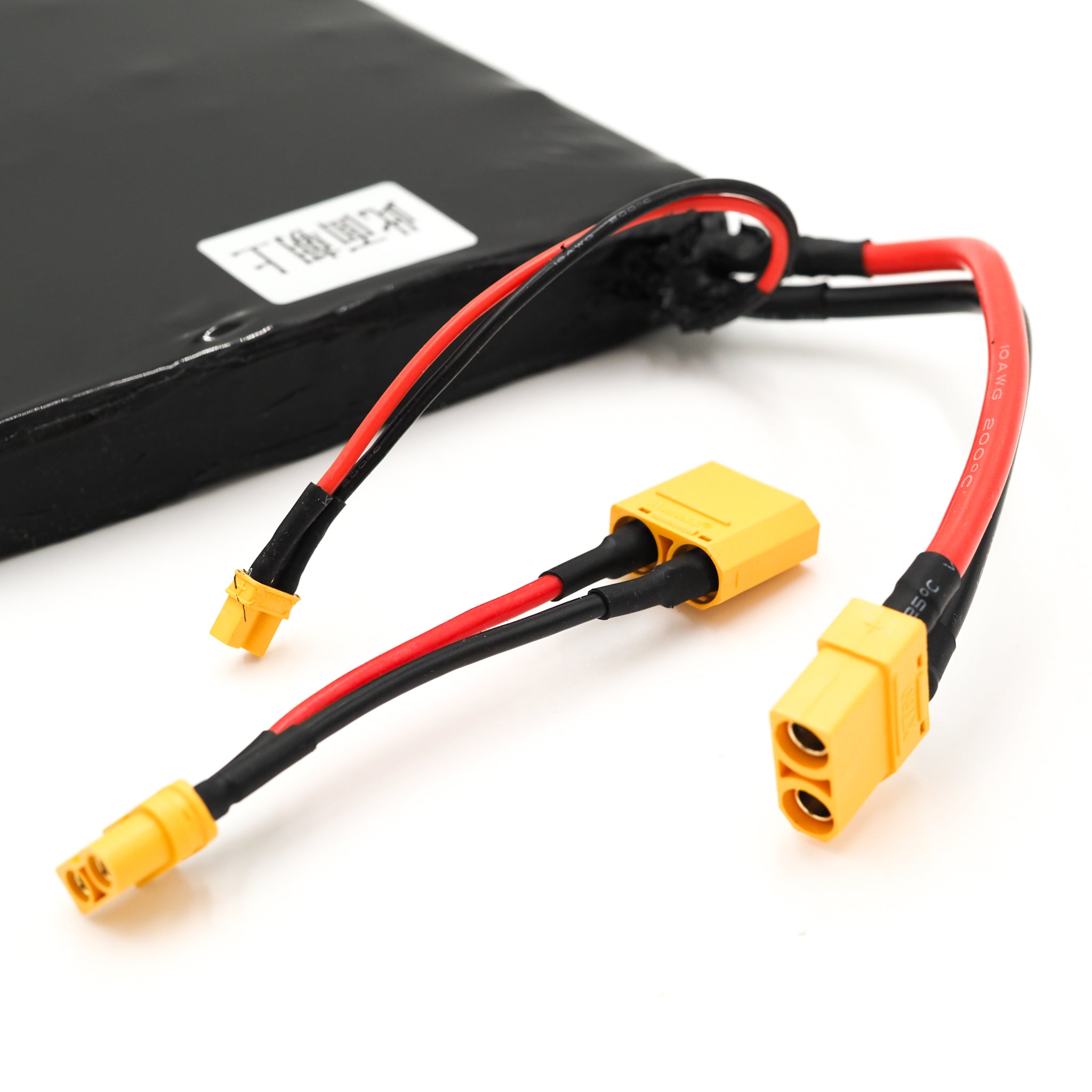 ONSRA ZENO 99 Wh travel-safe and 259 Wh extended-range electric skateboard batteries next to the high-power 14S VELAR electric longboard, showcasing the difference between airline-approved portable packs and full-size 1036 Wh performance systems.